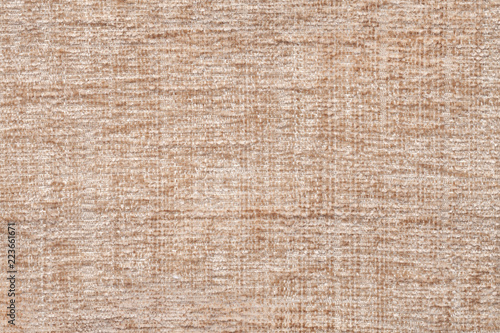 Light beige background of soft, fleecy cloth. Texture of textile closeup