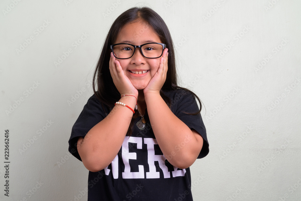 Young cute Asian nerd girl wearing eyeglasses Young cute Asian nerd girl wearing eyeglasses