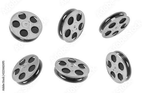 3d rendering of six black movie tape reels in different angles on white background.