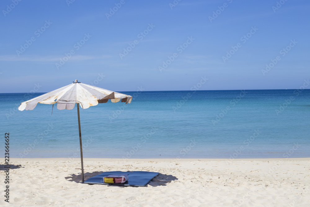 Umbrellas in a beautiful day on Surin beach in Phuket Thailand