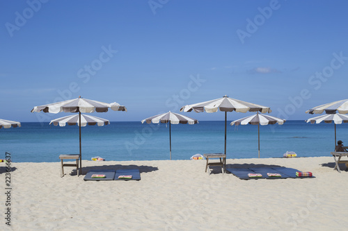 Umbrellas in a beautiful day on Surin beach in Phuket Thailand