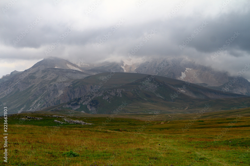 cute nordic mountain landscape with heavy clouds, natural landscape photo