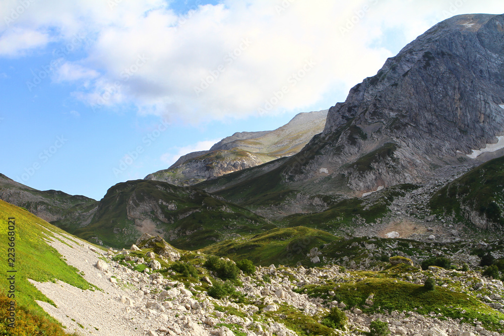 natural landscape photo of cute mountain passage landscape with light blue sky