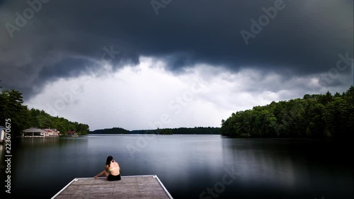 Dark cumulus storm clouds approaching a cottage dock on Lake Joseph, Ontario. photo