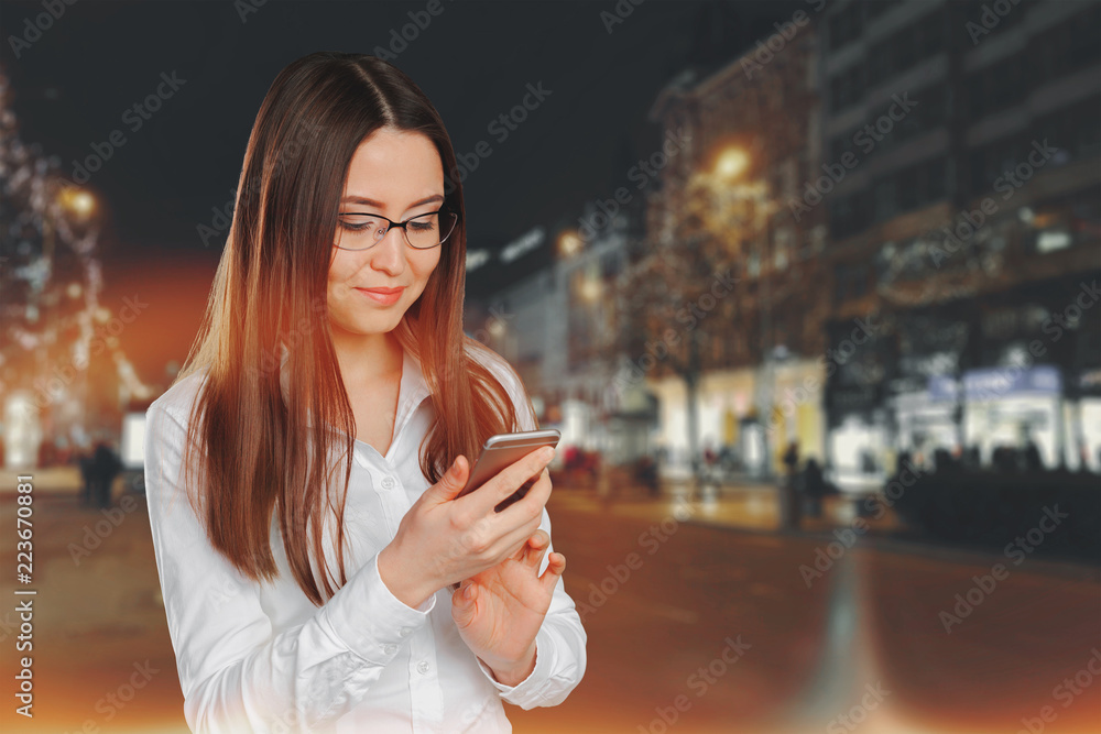 Young, confident, successful and beautiful business woman with the mobile phone isolated Young, confident, successful and beautiful business woman with the mobile phone isolated