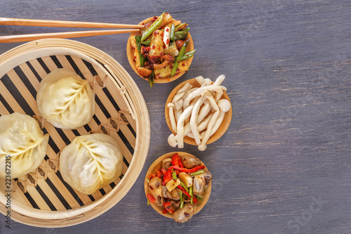 Traditional Chinese dishes - steam dumplings, hot salads, snacks Dam Sam. Top view. Copy space