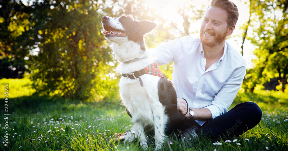 Man embracing his dog in tha nature Man embracing his dog in tha nature