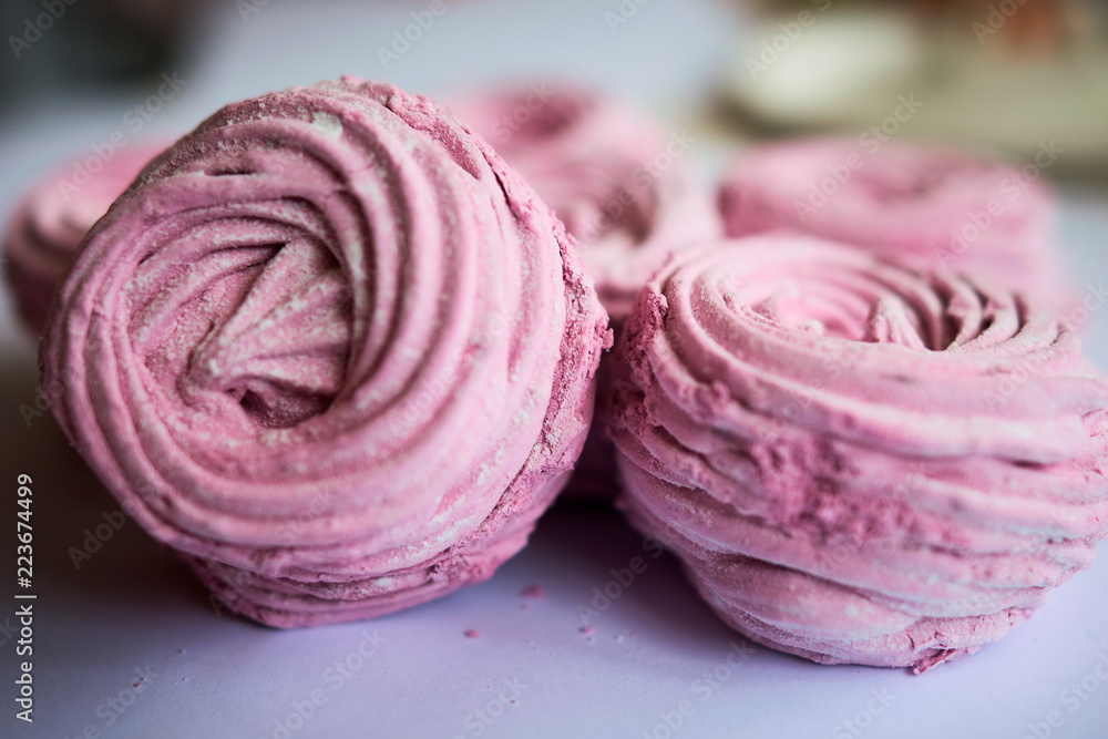 Pink marshmallow on a white table Pink marshmallow on a white table