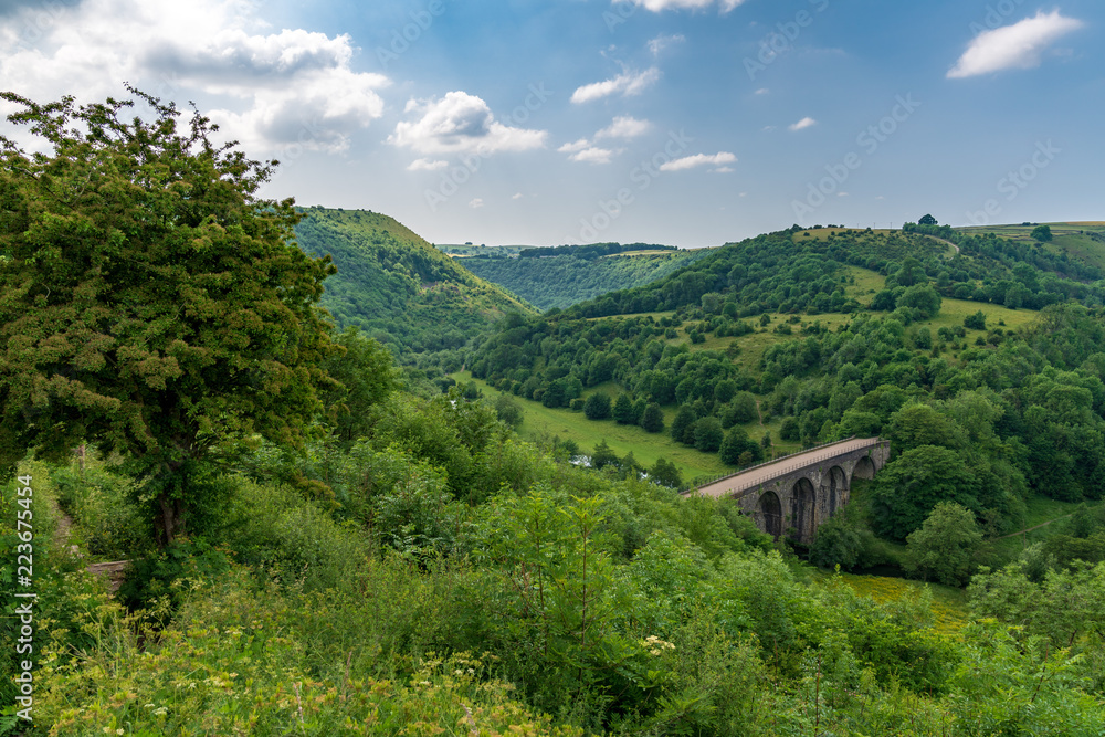 Peak District landscape with the Headstone Viaduct over the River Wye in the East Midlands, Derbyshire, England, UK