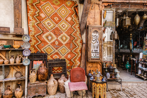 A souvenir shop in Fez, Morocco selling beautiful things like rugs, antiques, pottery and jewelry