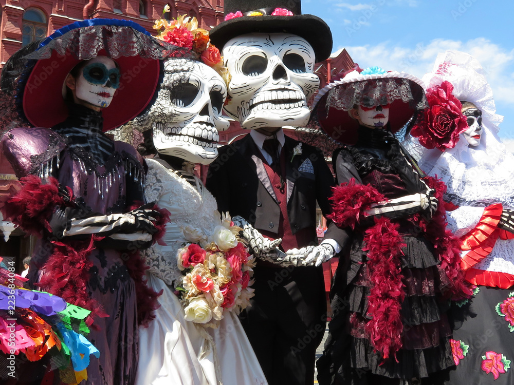 Day of the Dead. People in death masks and skeleton costumes during  traditional Mexican holiday Dia de los Muertos Stock Photo | Adobe Stock