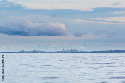 Auckland cityscape from Matakatia beach - Whangaparaoa Peninsula photo