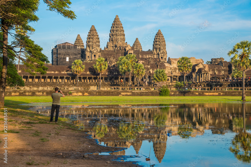 The beautiful view of Angkor Wat the massive and largest religion monument in the world at sunset. Located in Siem Reap, Cambodia. The beautiful view of Angkor Wat the massive and largest religion monument in the world at sunset. Located in Siem Reap, Cambodia.