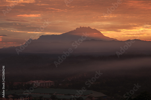 Amazing Beautiful burning cloud during sunrise with Mount Kinabalu as Background