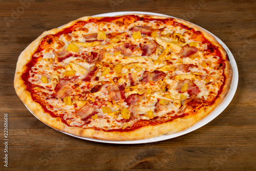Pizza with bacon and pineapple