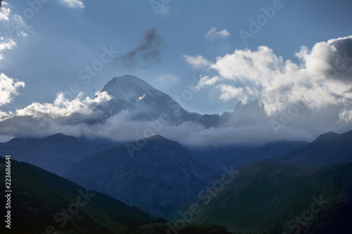 Panorama of the Mountain at dawn, the tents of tourists are on the hill, Georgia, Kazbek