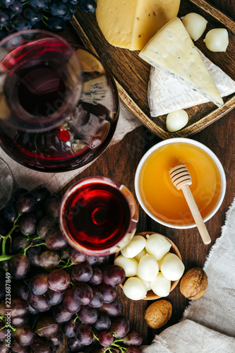 Cheese and wine, Decanter and glasses, wooden background, appetizer, grapes