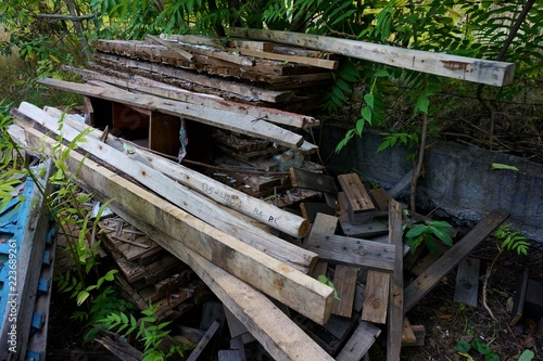 Wooden old planks stacked in the courtyard.