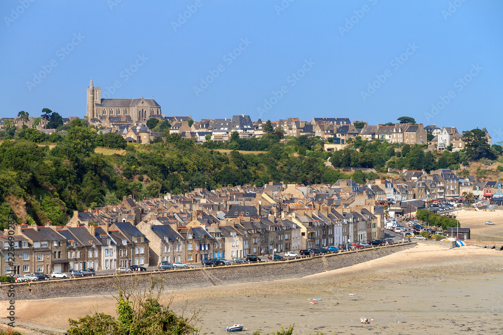 Beautiful cityscape view of the skyline and beach at low tide of the city Cancale, France, in summer
