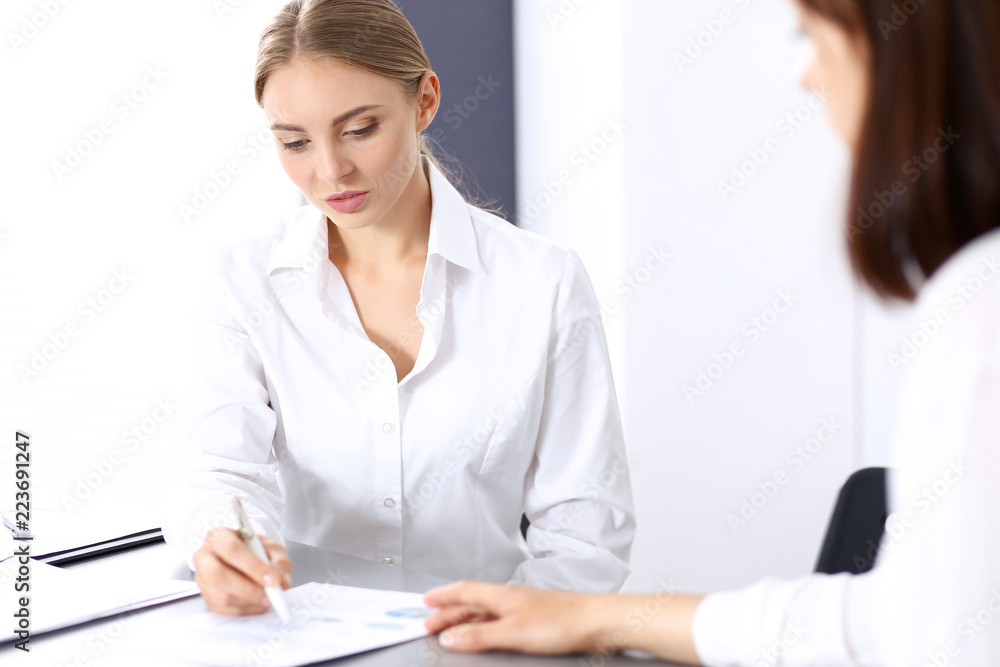 Group of business people or lawyers discussing terms of transaction in office. Meeting and teamwork concept Group of business people or lawyers discussing terms of transaction in office. Meeting and teamwork concept