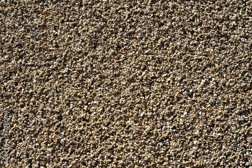 Foto Pattern of fine gravel particles bonded together by resin.