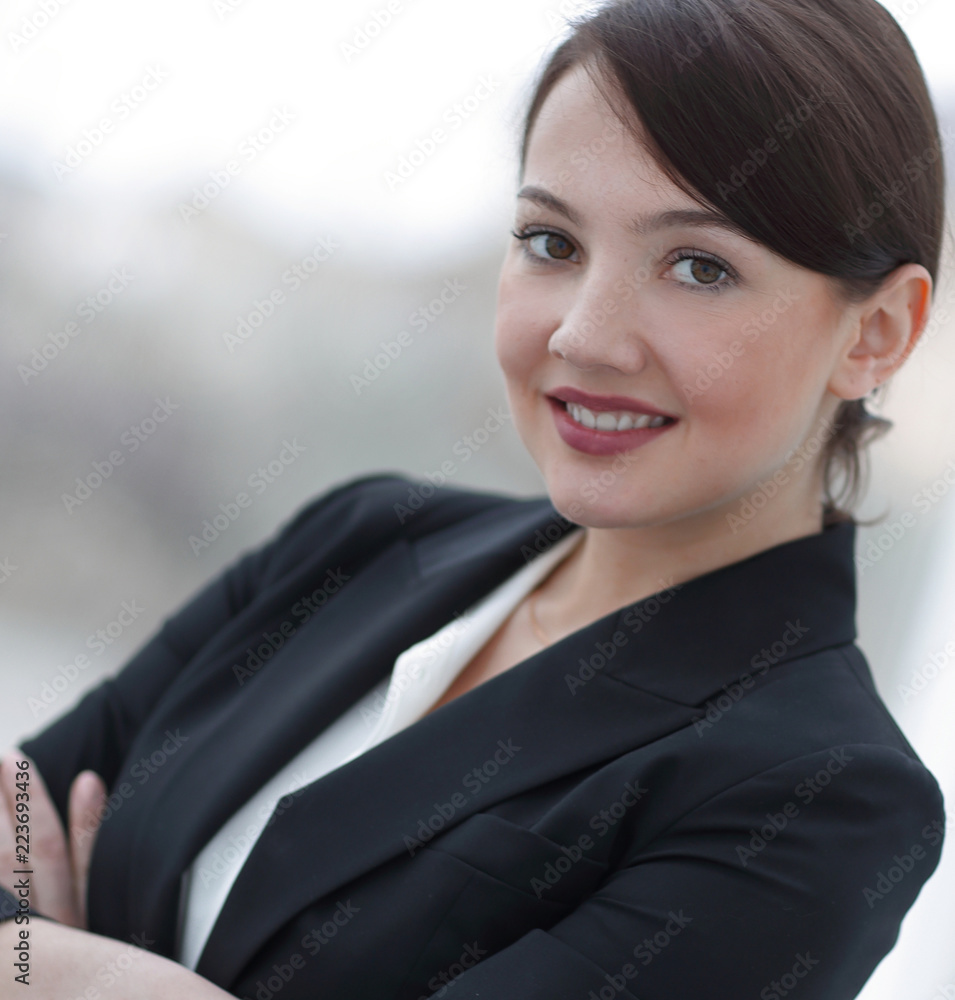 successful young business woman on the background of the office. successful young business woman on the background of the office.