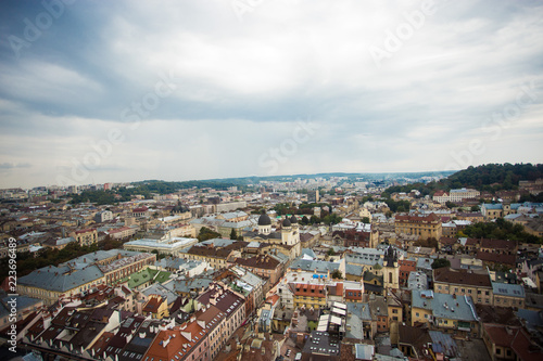 Fototapeta Naklejka Na Ścianę i Meble -  Aerial view old european city with rainy clouds on background