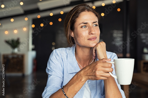 Fényképezés Mature woman drinking coffee