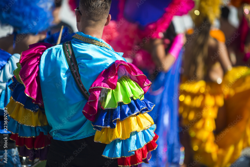 Abstract view of carnival dancers in colorful frilled costumes