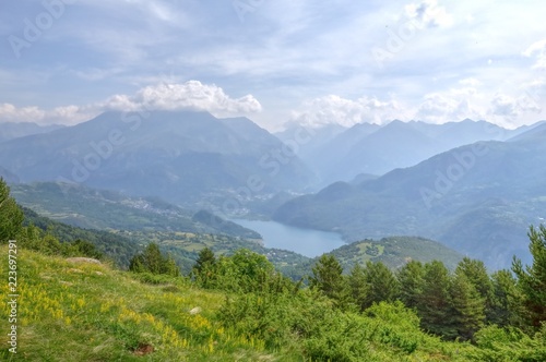 A Bubal lake landscape seen from the path to the Piedrafita de Jaca lake in the Aragonese Pyrenees in a cloudy and sunny day