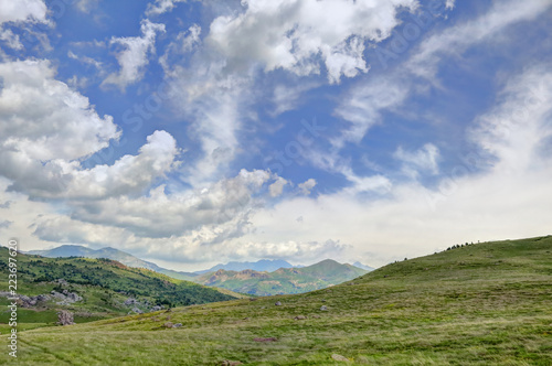 The mountains and the massif along the green path to the Piedrafita de Jaca lake in the aragonese Pyrenees mountains © Isacco