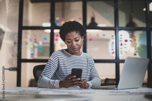 African American female working late in an office