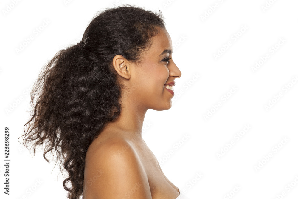 Profile of young beautiful dark-skinned woman on a white background Profile of young beautiful dark-skinned woman on a white background
