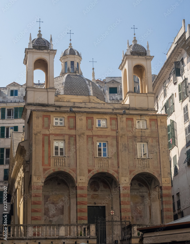 medieval church with frescoes on the façade and double bell tower. Genoa, Italy