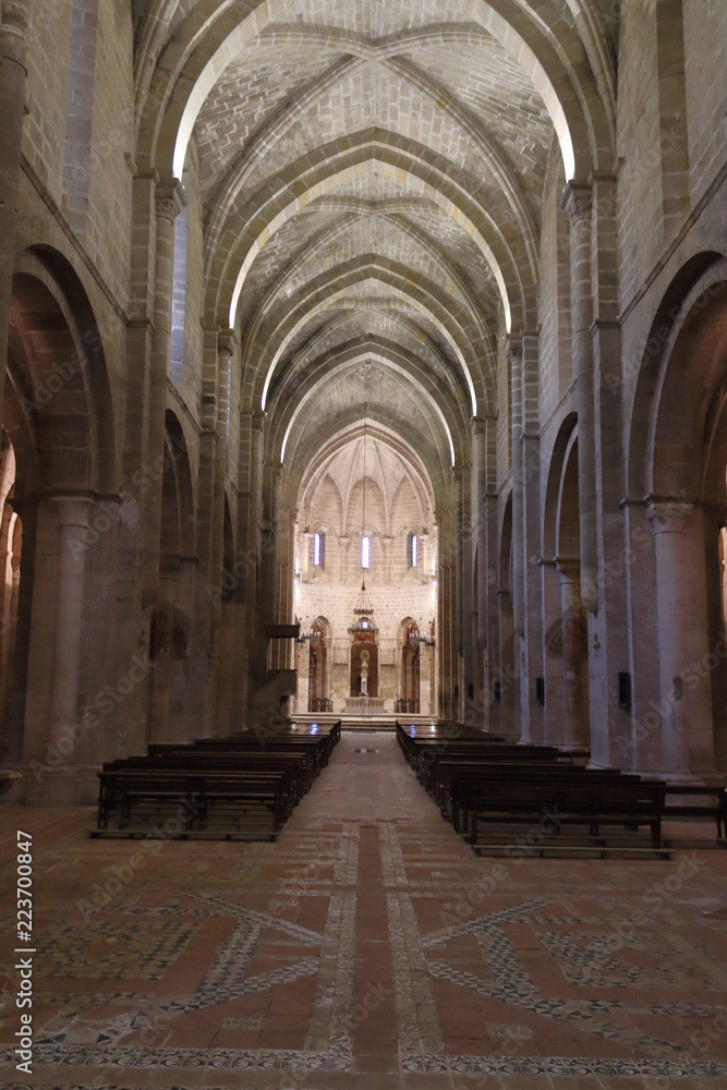 The main central nave, the dome and the baroque retable in the Veruela Cistercian abbey gothic church, in Aragon region, Spain