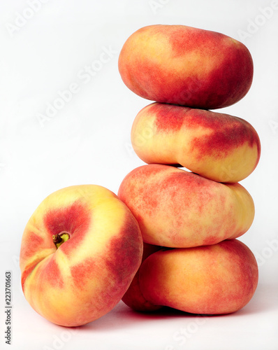 pile of saturn peaches isolated over white background