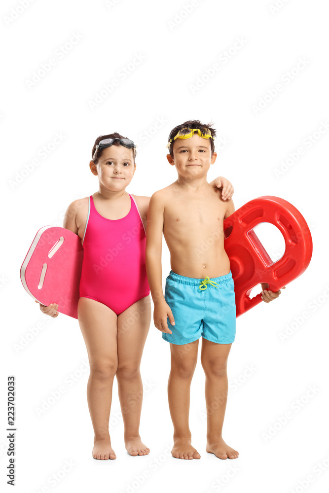 Little girl and boy in swimming suits holding swimming pads Stock