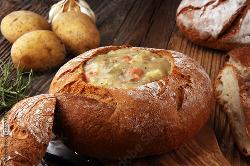 Homemade potato cream soup, served in bread bowl.