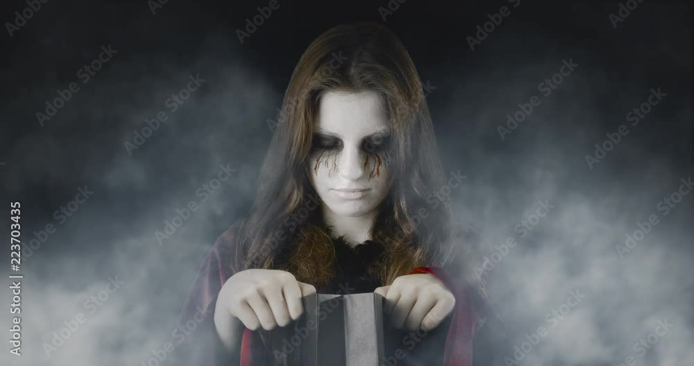 Checking the treats - teenage girl, disguised for Halloween, standing in an eerie, foggy environment - ProRes
Checking the treats - teenage girl, disguised for Halloween, standing in an eerie, foggy environment - ProRes