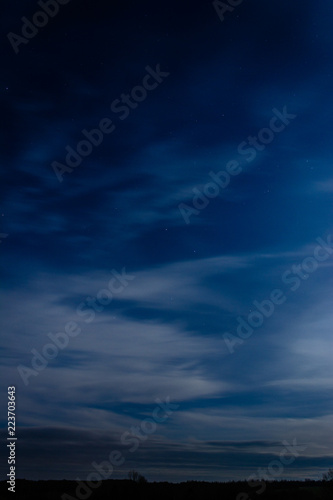 Amazing blue sky over Ukrainian Carpathians, blurred with white clouds