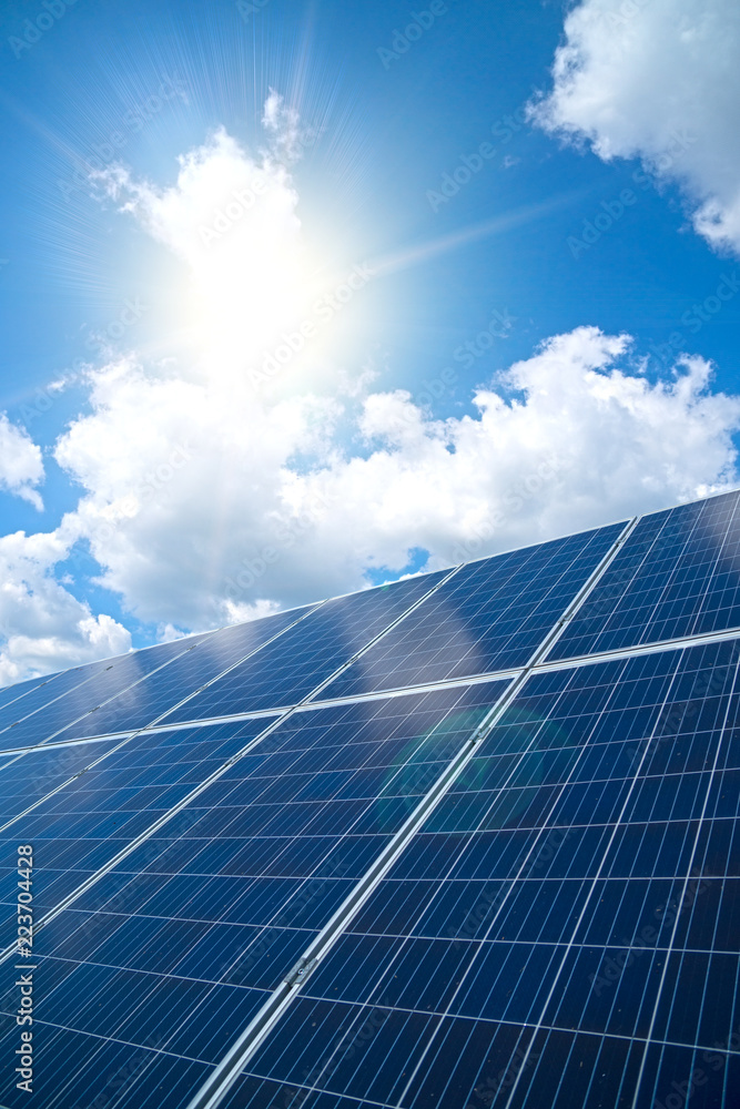 Blue solar panels over blue sky. Renewable energy.
