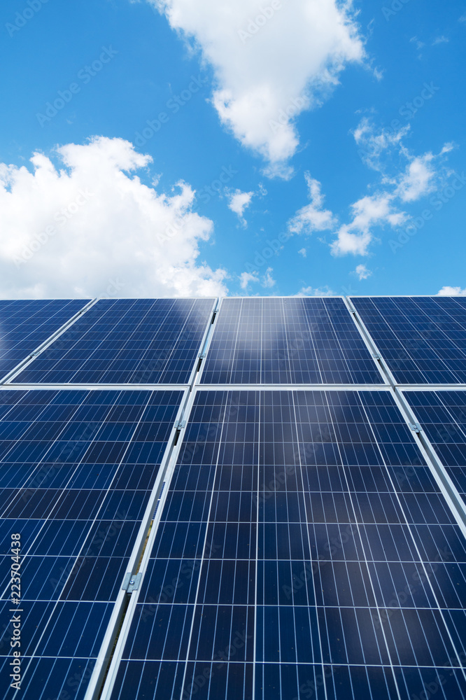Blue solar panels over blue sky. Renewable energy. Blue solar panels over blue sky. Renewable energy.