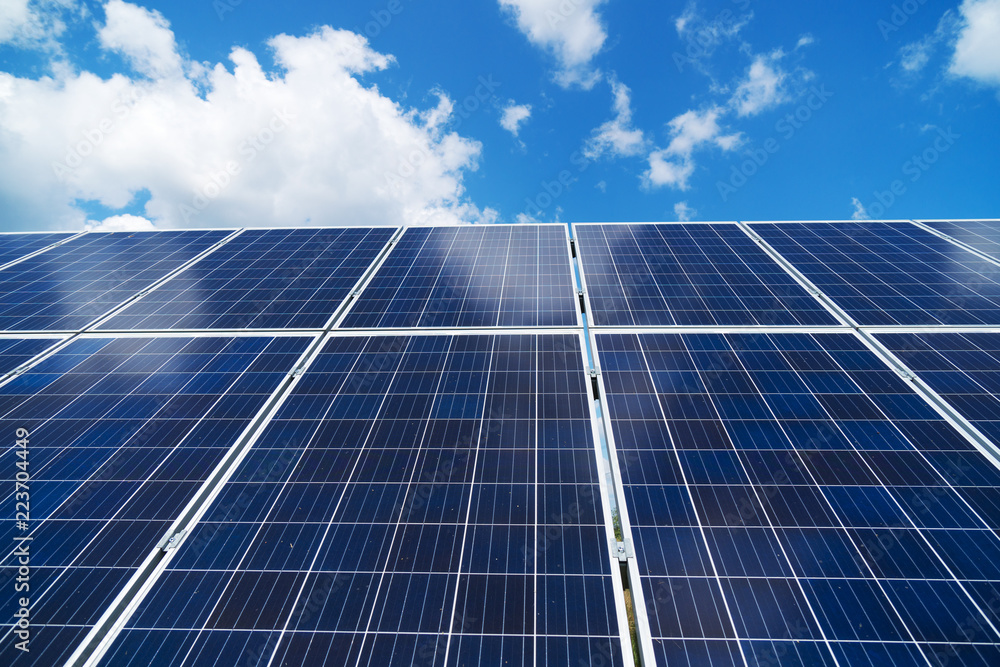 Blue solar panels over blue sky. Renewable energy. Blue solar panels over blue sky. Renewable energy.