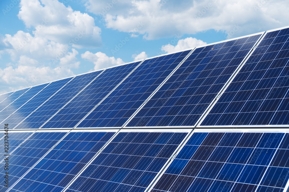 Blue solar panels over blue sky. Renewable energy. Blue solar panels over blue sky. Renewable energy.