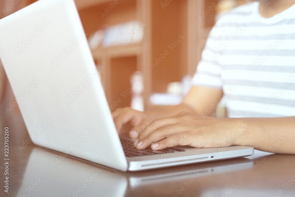 Fototapeta premium close up finger hand people young man connect online business using computer laptop copy print keyboard. or sitting work at on the desk. technology online connection.