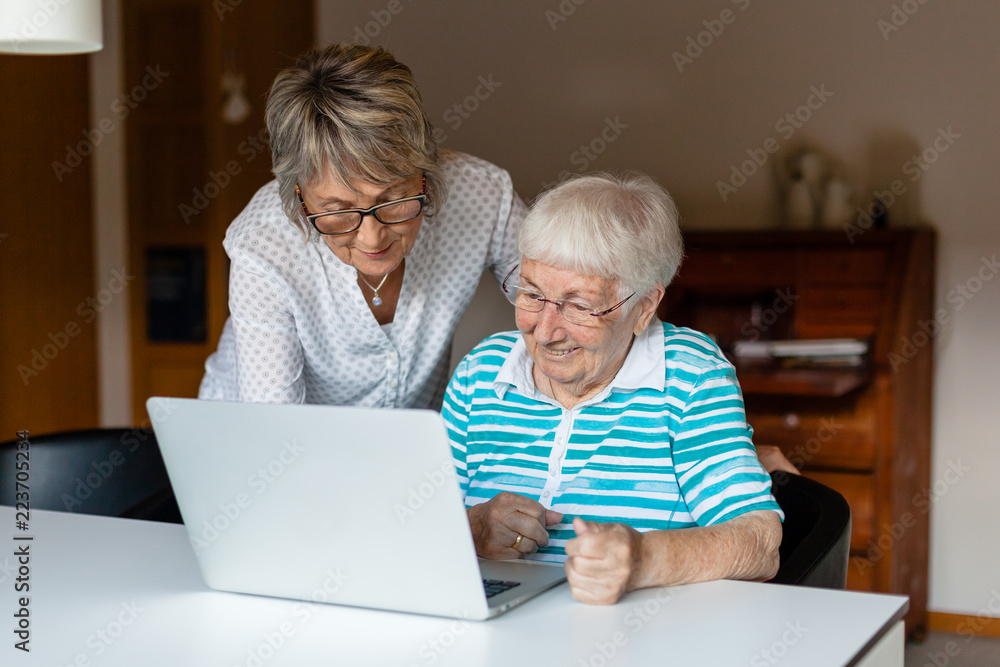 Very old senior woman learning to use a computer Very old senior woman learning to use a computer