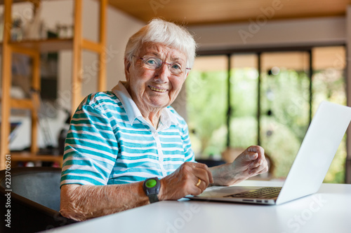 Photos Very old senior woman using a computer