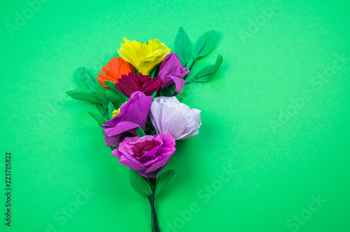 tools making crepe paper flowers green background