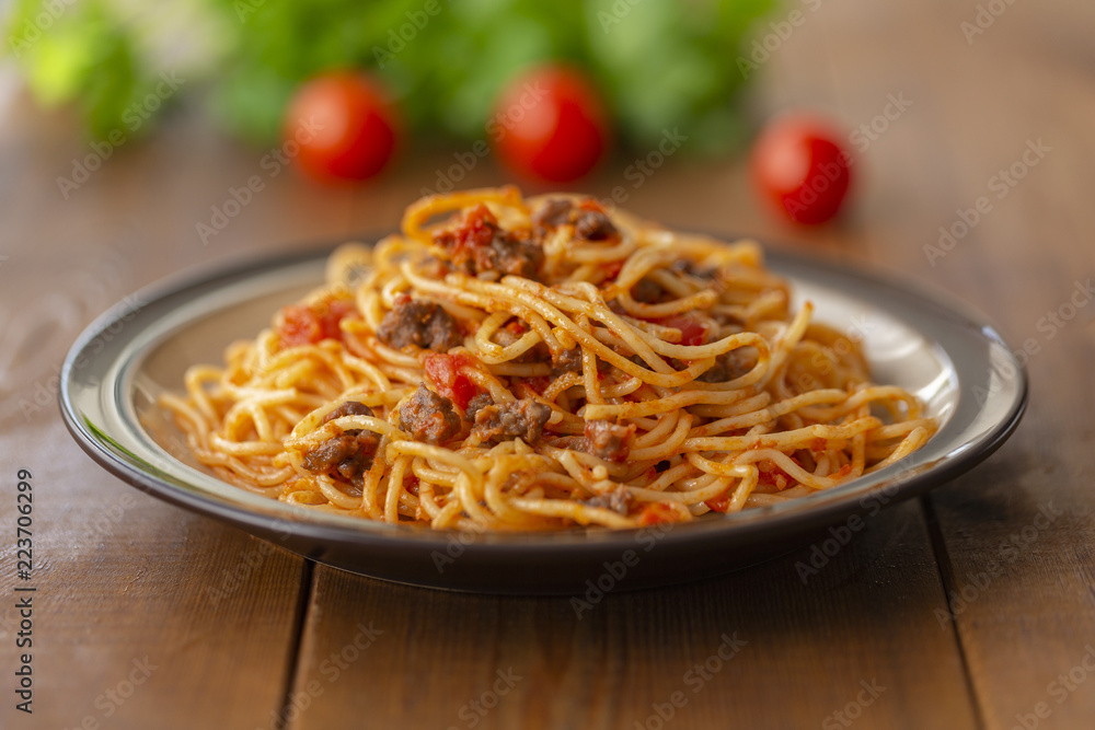 Spaghetti bolognese pasta with tomato sauce and minced meat. Homemade healthy italian pasta on wooden background Spaghetti bolognese pasta with tomato sauce and minced meat. Homemade healthy italian pasta on wooden background