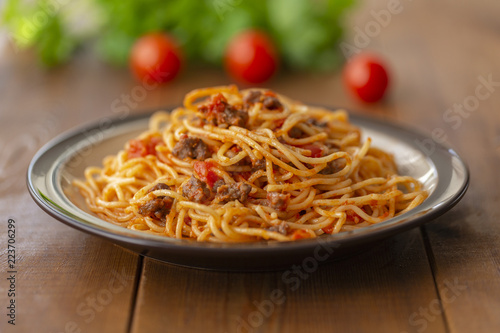 Spaghetti bolognese pasta with tomato sauce and minced meat. Homemade healthy italian pasta on wooden background